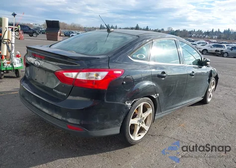 2014 Ford Focus Titanium z USA, uszkodzony, nr VIN 1FADP3J20EL132573